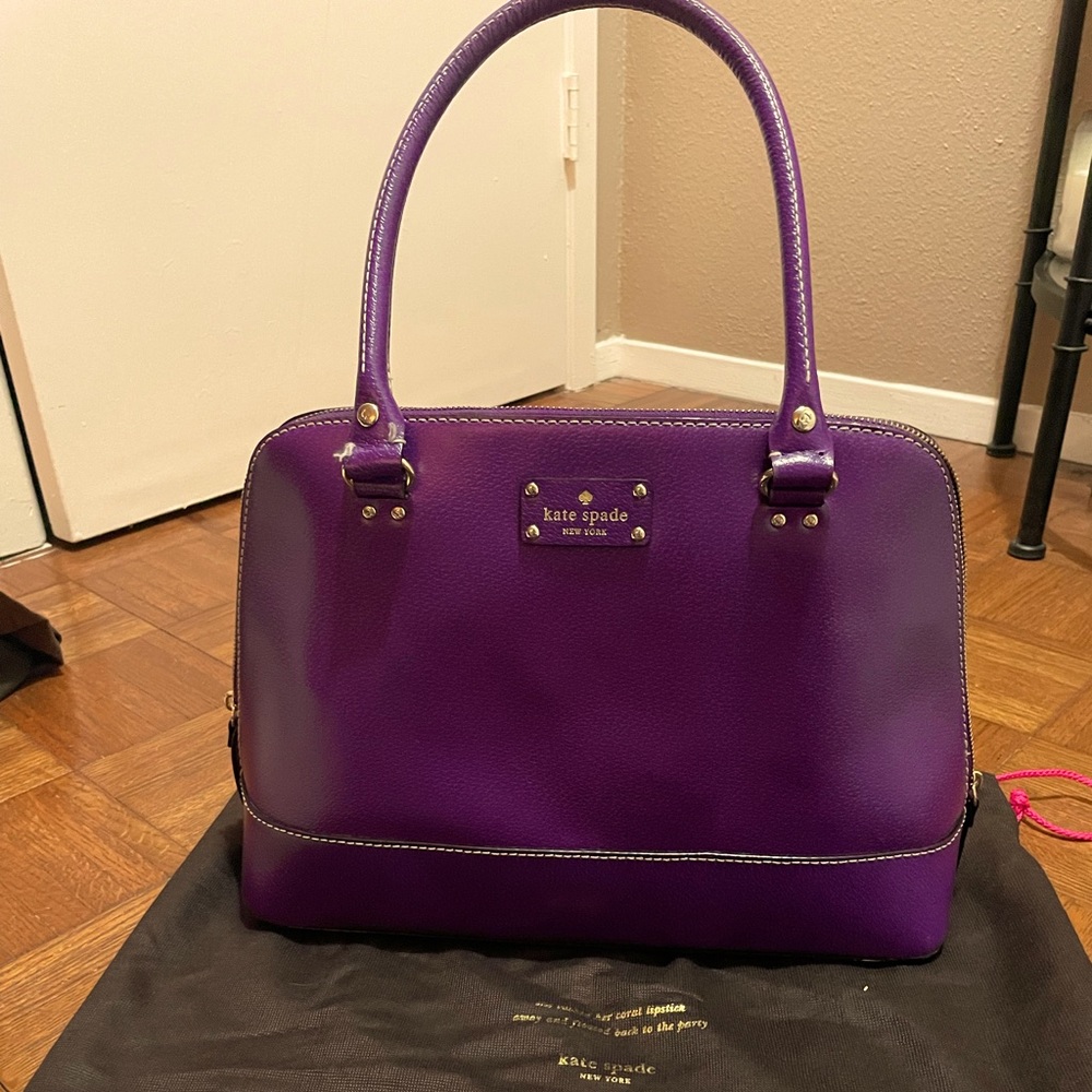 Purple Kate Spade leather top handle purse with double zipper